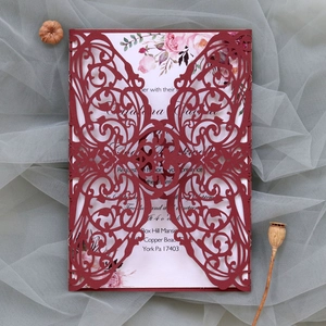 Detailed laser-cut burgundy butterfly invitation card with floral insert on mesh fabric