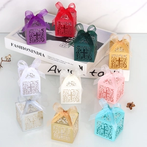 Laser cut favor boxes with cross design and ribbons in ten vibrant assorted colors