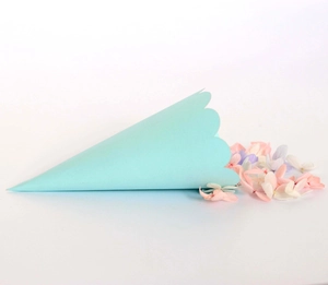 Detail of light blue wavy edge paper petal cone for weddings and party celebrations