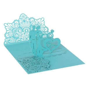 Detail of light blue 3D pop-up wedding card with laser-cut Mr & Mrs heart silhouette