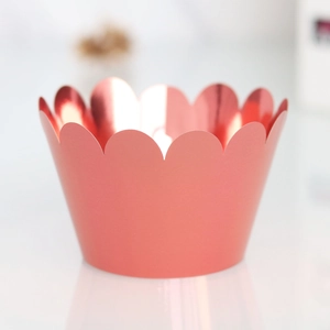 Detail of rose gold mirror finish cupcake wrappers with elegant laser cut wave edges