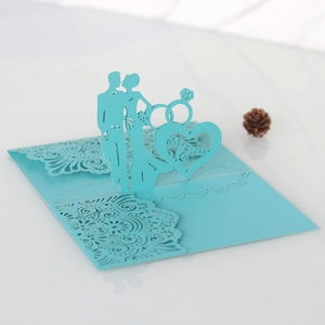 Detailed 3D laser-cut wedding invitation featuring a blue Mr & Mrs silhouette design