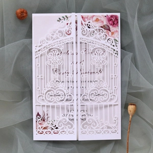 Detailed laser-cut gate design wedding invitation with floral pink inner card