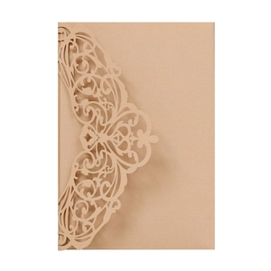 Detailed laser-cut floral pattern on champagne gold lace wedding invitation cover