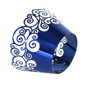 Elegant metallic blue laser-cut cupcake wrappers with intricate hollow swirl patterns
