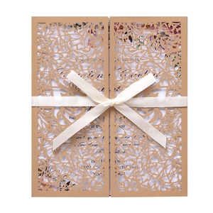 European laser cut wedding invitation with hollow leaf pattern and white satin ribbon