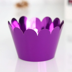 Detail of purple foil cupcake wrapper with laser-cut scalloped edges and metallic mirror finish