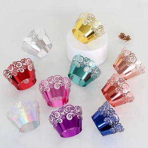 Detailed laser-cut cupcake wrappers in 10 metallic colors showing intricate swirl patterns