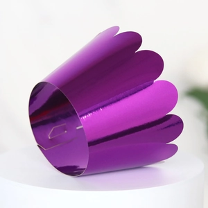 Detail of purple mirror finish cupcake wrapper with laser-cut scalloped petal edges