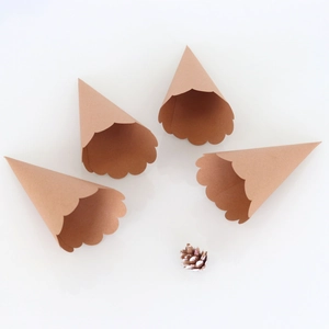 Brown kraft paper cones with wavy petal edges for wedding confetti or dried flowers