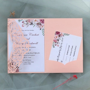 Detailed laser-cut butterfly wedding invitation with floral insert on pearlescent paper