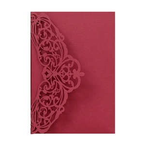 Detailed laser-cut dark red wedding invitation card with intricate floral patterns