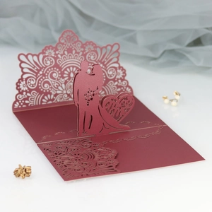 3D laser cut burgundy wedding card featuring Mr & Mrs heart silhouette and hollow design