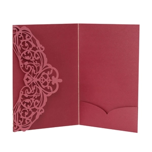 Elegant burgundy laser-cut lace invitation cover with intricate floral vine hollow patterns