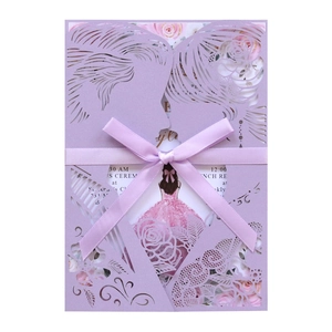 Detail of laser-cut invitation with purple lovers silhouette and pink ribbon bow