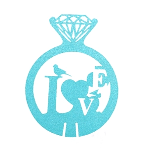 Detail of light blue glitter diamond ring card with LOVE letters and bird for wedding decor