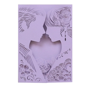 Detail of laser-cut lavender wedding invitation featuring rose patterns and couple silhouette