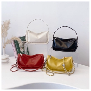 Chic women's crescent handbags in four colors with stylish metal chains and leather straps