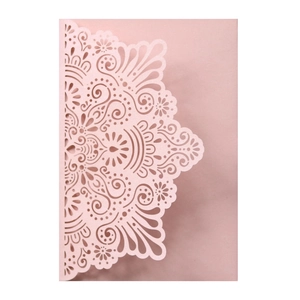 Detailed laser-cut wedding invitation featuring intricate pink lace mandala paper patterns