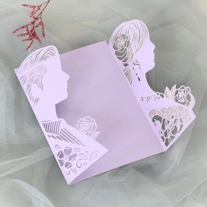 Detailed laser-cut silhouette of a couple with floral lace pattern on lavender card