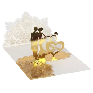 3D laser cut gold wedding invitation featuring Mr & Mrs silhouettes and rings