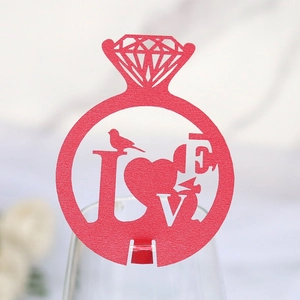 Detail showing red hollow paper diamond ring card with LOVE bird and heart design