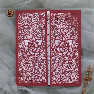Detailed laser cut red rose wedding invitation card with elegant floral hollow patterns