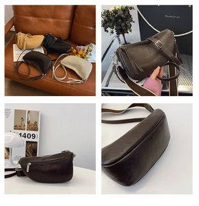 Detailopname van een vintage plissé halve maan crossbodytas met verstelbare riem en rits