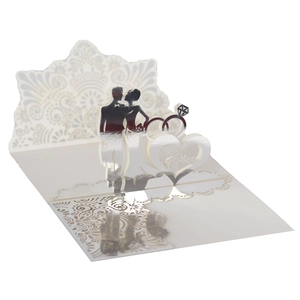 Detail of 3D laser-cut wedding card featuring bride, groom, and silver mirror ring