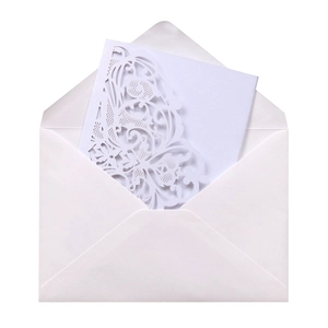 Detailed laser-cut butterfly invitation set with elegant white envelope and card
