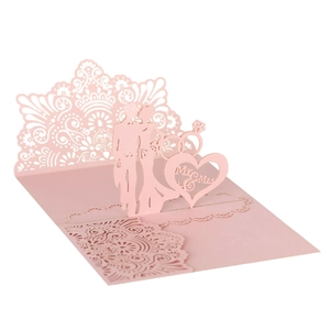 Detailed laser cut 3D pink wedding invitation featuring Mr & Mrs silhouettes and lace pattern