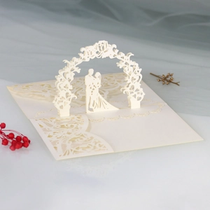 Detailed laser-cut wedding invitation featuring a 3D bridal silhouette and ornate archway