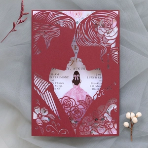 Laser cut wedding invitation detail featuring a romantic couple silhouette and floral lining