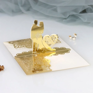 Detailed 3D laser-cut wedding card with gold foil Mr & Mrs design and lace patterns