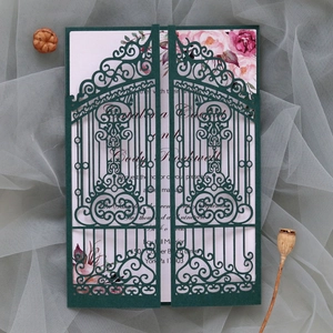 Laser-cut dark green wedding invitation with elegant floral insert and gate design