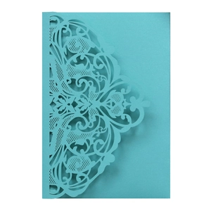 Intricate laser-cut wedding invitation in pearl blue paper with baroque lace pattern