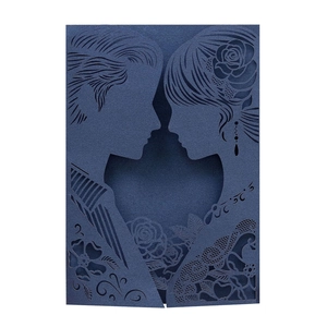 Detailed laser-cut navy blue wedding invitation card with bride and groom silhouette