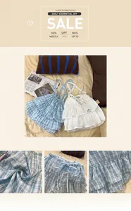 Detail of ruffled camisole top with drawstring bow and blue plaid pattern texture