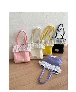 Detailed display of vintage polka dot ruffle canvas tote bags in five assorted colors