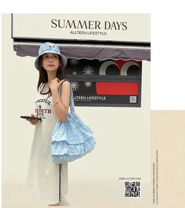 Detailed view of light blue checkered ruffle tote bag and matching sun hat set for summer