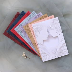 Laser-cut wedding invitations with couple silhouettes in eight elegant paper colors