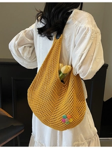 Handwoven yellow hollow-out tote bag with floral charm and large capacity for summer beach