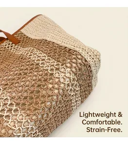 Detail of woven straw tote bag texture with brown leather handle and fabric lining