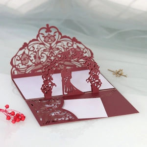 Detailed laser cut burgundy 3D pop-up wedding invitation with lace pattern and couple silhouette