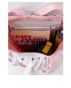 Top view of large capacity pink tote bag showing interior space for tablet and books