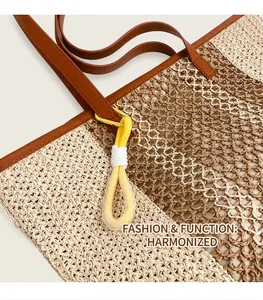 Detail of woven beach tote showing two-tone hollow texture and brown leather handle