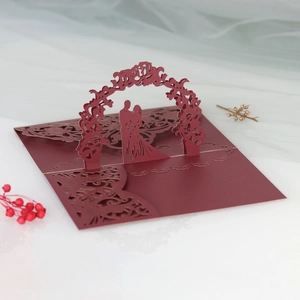 3D laser-cut wedding invitation featuring a romantic couple silhouette and floral arch