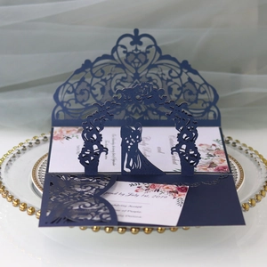 Navy blue laser cut 3D wedding invitation with floral inner card on glass tray