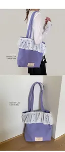 Close-up of lavender canvas tote bag with white lace ruffles and floral embroidery details