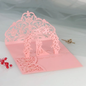 Detail of 3D laser-cut wedding card featuring a romantic kissing couple silhouette